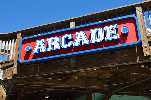Looking up at a generic boardwalk arcade sign.