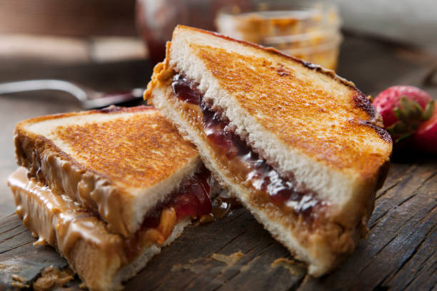Grilled Peanut Butter and Strawberry Jelly Sandwich Grilled Peanut Butter and Strawberry Jelly Sandwich peanut butter and jelly sandwich stock pictures, royalty-free photos & images