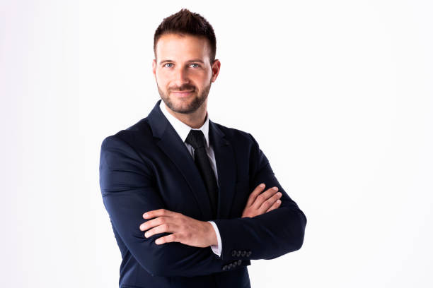 istock Handsome businessman wearing suit while standing at isolated white background 1259096979