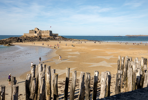 Saint-Malo, France - September 15, 2018: Unidentified people and the stars on the beach in Saint Malo. Brittany, France