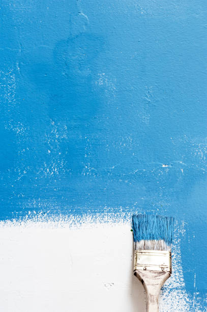 istock Paint brush on the wall 1259105940