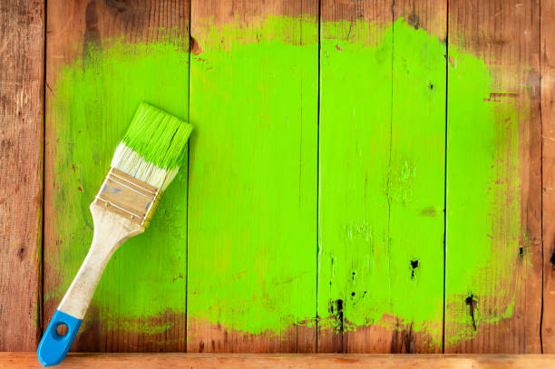istock Paint brush on wooden texture background 1259107689