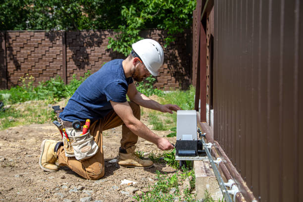 istock Electrician Builder at work, servicing the fuselage industrial switchboard. Professional in overalls with an electrician's tool. 1259110603
