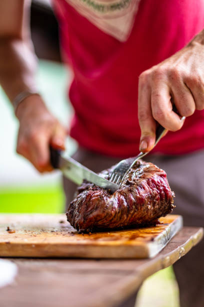 istock barbeque meat preparation in a summer day 1259114134