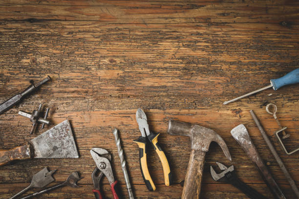 istock Group of old tools for home repair on old wooden table 1259119512