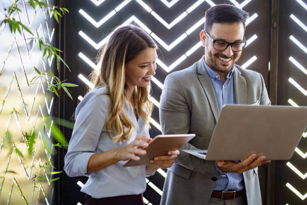 istock Business people having fun and chatting at workplace office 1259122893