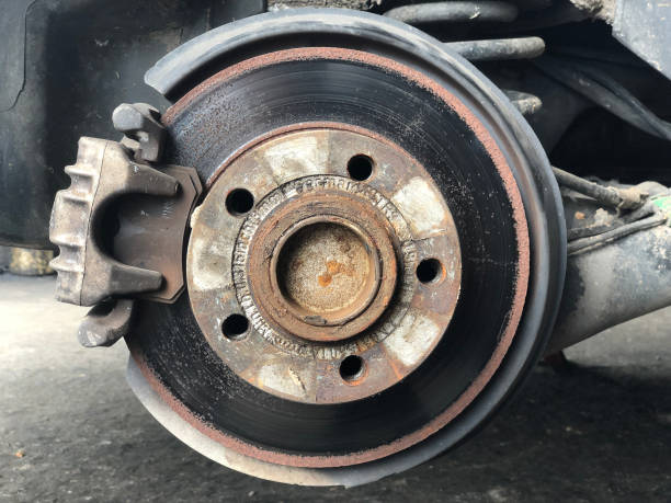 istock Disc break inside wheel car is fixing at garage. 1259122903