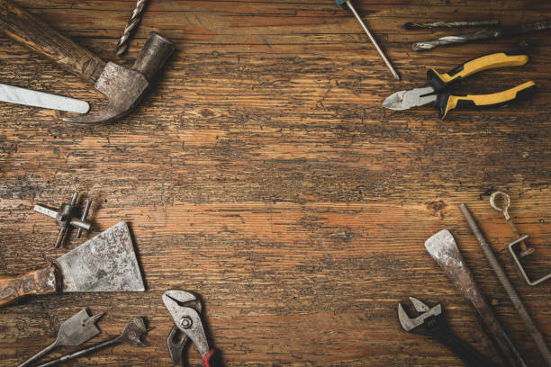 istock Group of old tools for home repair on old wooden table 1259123475