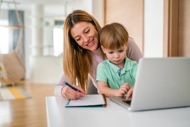 istock Mother working at home-office with child on her lap 1259134505