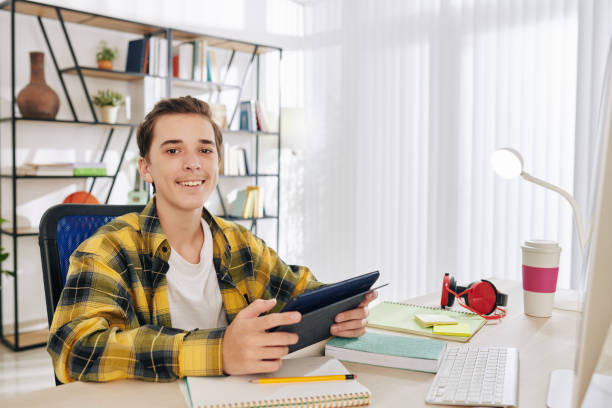 istock Teenage boy with digital tablet 1259138969