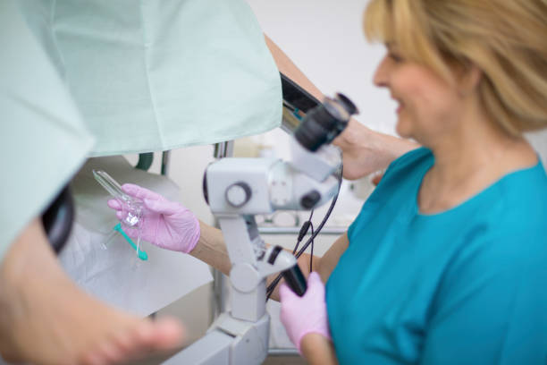 istock Professional gynecologist taking womans cervix sample during examination 1259141396