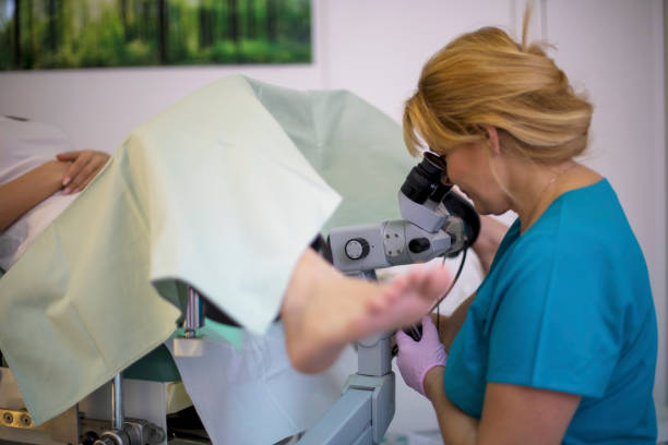 istock Professional gynecologist taking womans cervix sample during examination 1259141413