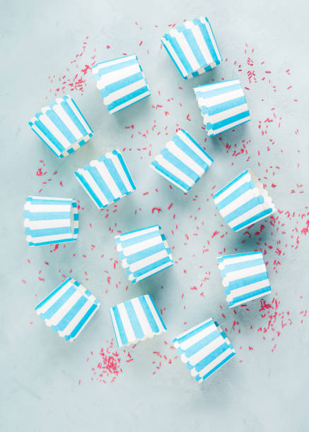 istock Striped blue paper cases for baking cup cakes 1259149584