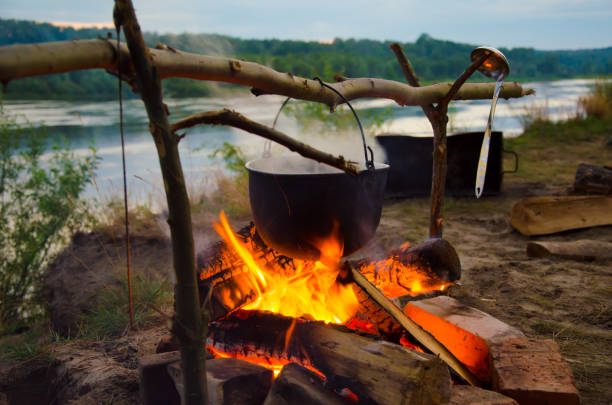 istock camping cauldron. cauldron at the stake. rest by the river 1259149894