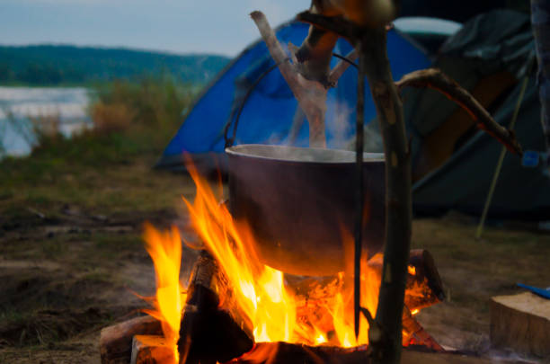 istock camping cauldron. cauldron at the stake. rest by the river 1259149896