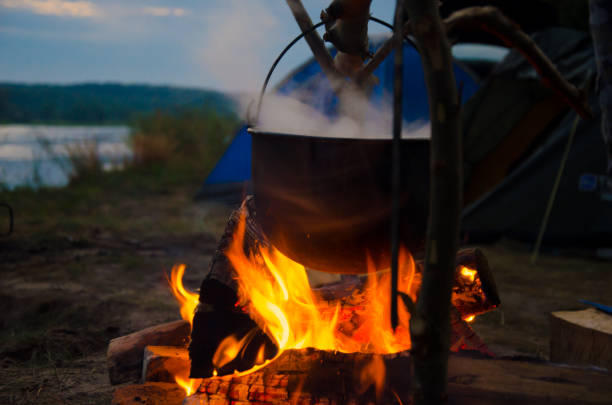 istock camping cauldron. cauldron at the stake. rest by the river 1259149908