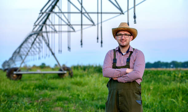 istock Farmer in the field with irrigation system. Agriculture 1259149936