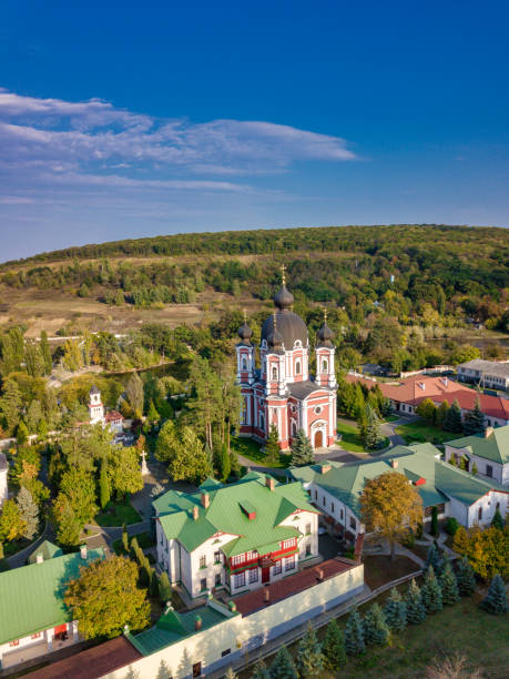 istock Flight over a christian monastery surrounded by autumn forest. Kurky monastery, Moldova republic of. 1259150226
