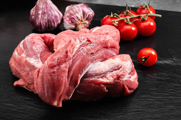 istock Beef raw fillet tenderloin on black marble background 1259150578