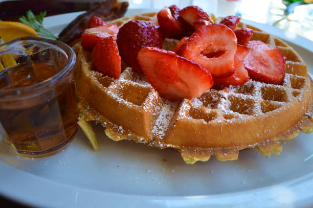 istock Waffles Topped With Strawberries And Powdered Suger 1259150677