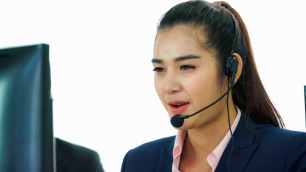 istock Business people wearing headset working in office 1259150814