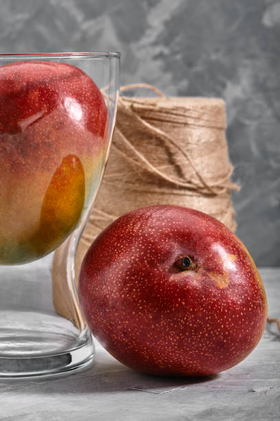 istock Fresh sweet mangoes on concrete background, side view. Flat lay. Copy space 1259150829