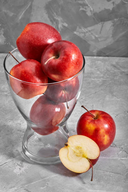 istock Red apples on the table. Top view with copy space on gray stone background 1259150868