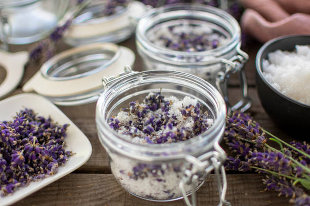 lavender bath salt in decorative mason jar in close-up aromatic lavender bath salt in decorative mason jar in close-up bath salt stock pictures, royalty-free photos & images