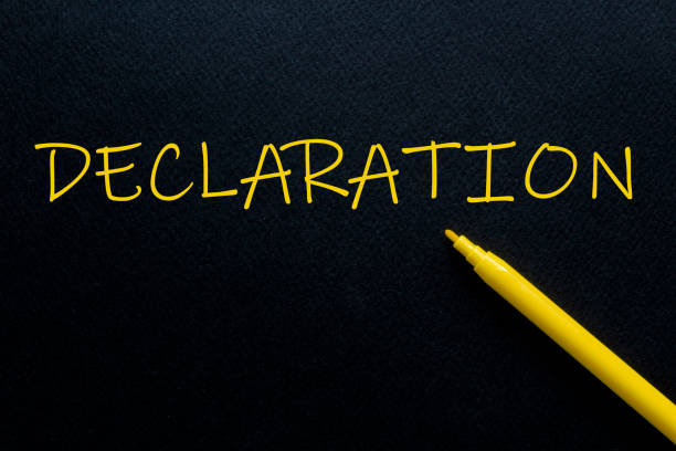 istock DECLARATION Yellow Pen with yellow text own rent at the black background 1259175030