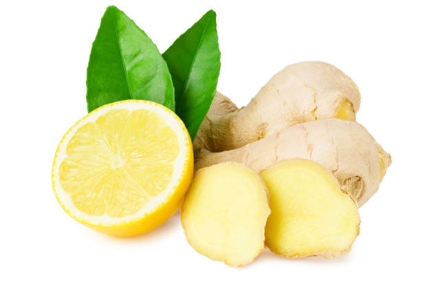 istock ginger roots with slices, green leaves and lemons isolated on white background 1259185070