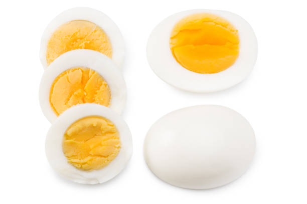 istock Single whole boiled egg with halved egg isolated on a white background. Top view 1259185076