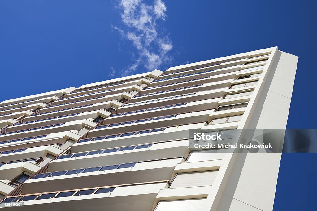 Modern building detail Corner of modern building with blue sky in background Apartment Stock Photo