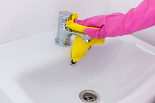 istock Cleaning Service Worker, hand in protective rubber gloves holding microfiber 1259197568