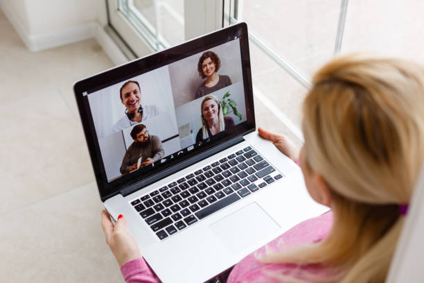 istock Woman Working From Home Having Group Videoconference On Laptop 1259205885