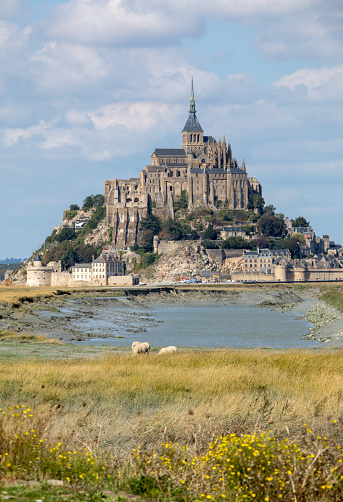 Mont Saint-Michel abbey in Normandy France, from 1979 is Unesco Heritage. All the architecture is considered historical monuments. In the year 709 the Bishop of Avranches, Saint Aubert built the first church. In 1204, Breton warriors set it on fire, the new monastery was completed in 1228 thanks to King Philip II Augustus