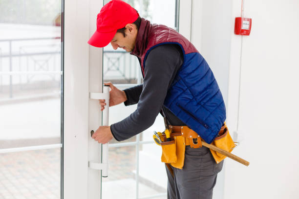 istock Young repairman adjusting a terrace door handle with screwdriver 1259213919