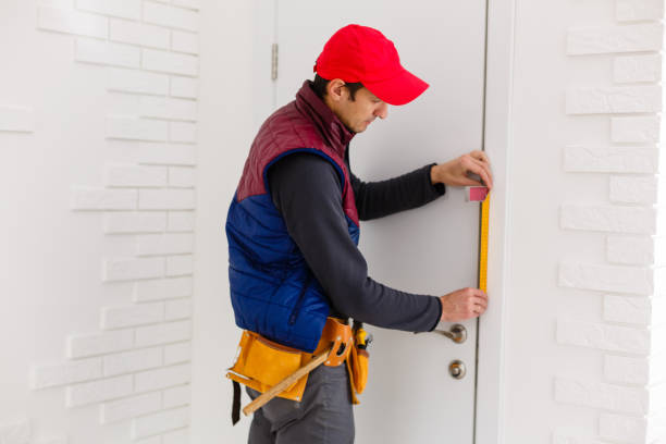 istock Young repairman adjusting a terrace door handle with screwdriver 1259214958