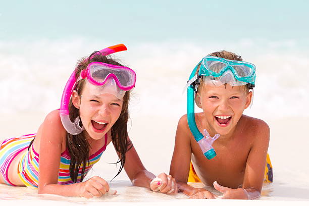 istock Happy boy and girl on beach 125922324