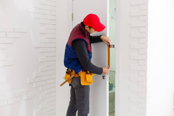 istock handsome young man installing a door in a new house construction site 1259223453