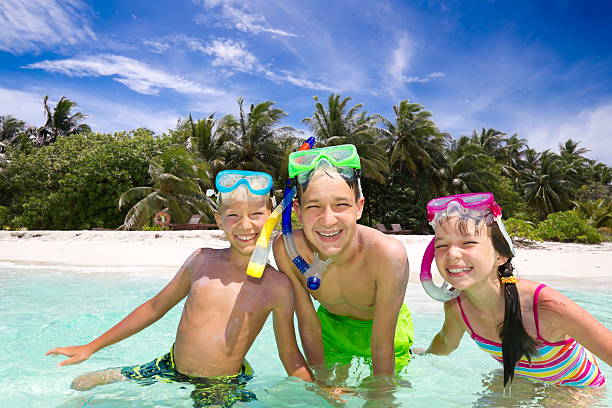 istock Children playing in sea 125922474