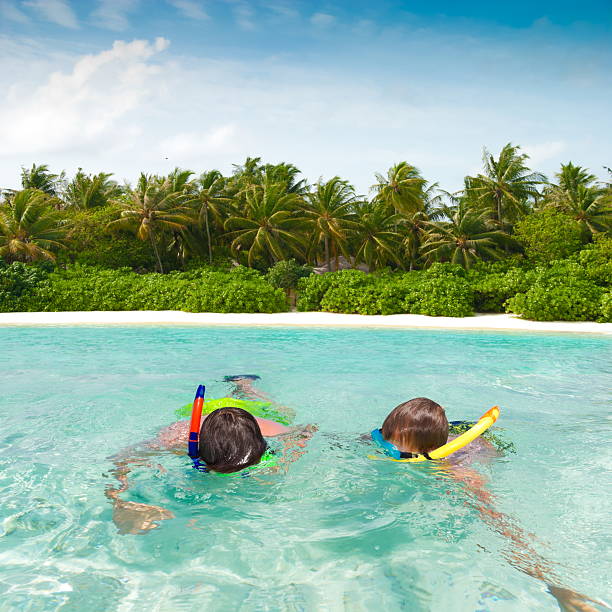 istock Children snorkeling in tropics 125922496