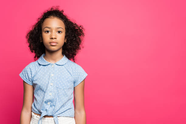 istock cute curly african american kid isolated on pink 1259226731
