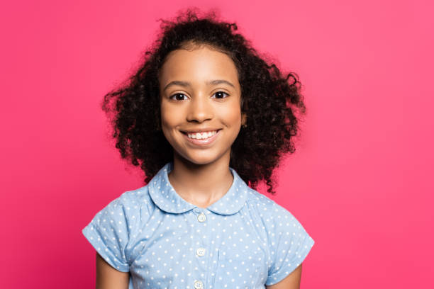 smiling cute curly african american kid isolated on pink smiling cute curly african american kid isolated on pink pre adolescent child stock pictures, royalty-free photos & images