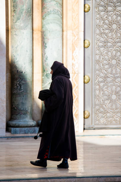 The Hassan II Mosque is a mosque in Casablanca, Morocco. It is the largest functioning mosque in Africa and is the 7th largest in the world. People staring outside waiting to go in to pray.