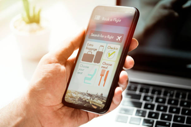 istock Book a flight, air travel app on mobile phone screen 1259247229