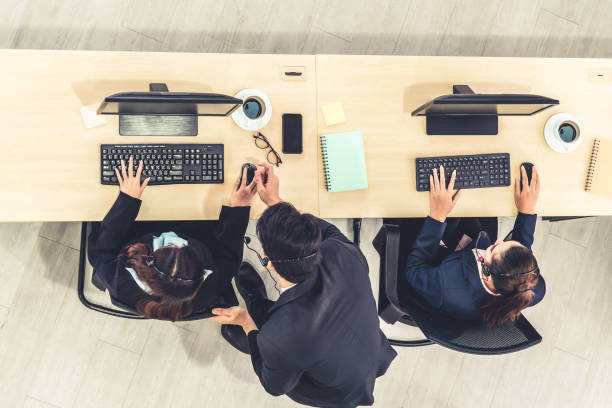 istock Business people wearing headset shot from top view 1259251347