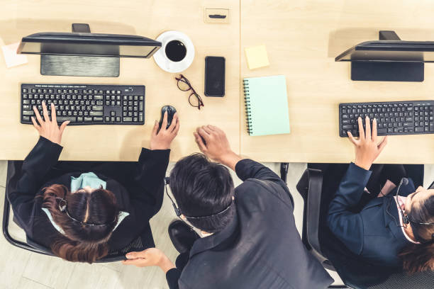 istock Business people wearing headset shot from top view 1259260874