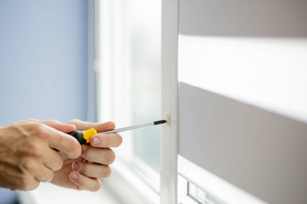 istock The man is repairing the plastic window 1259263538