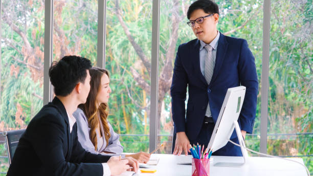 istock Angry business person dispute work problem in group meeting 1259265142