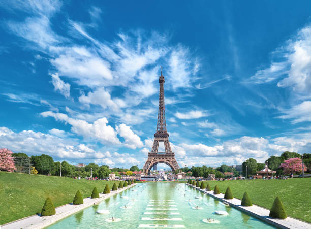 istock Symmetrical front panoramic view of Eiffel tower on the bright sunny afternoon taken from fountains of Trocadero. 1259265155